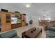 Open-concept living room featuring tile flooring, comfortable seating, and natural light at 1813 Caryle Ln, The Villages, FL 32162