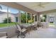 Inviting sunroom with bright windows, comfortable seating, and charming views of the landscaped backyard at 1813 Caryle Ln, The Villages, FL 32162