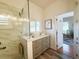 Bright bathroom featuring a frameless glass shower and custom cabinets, providing a clean and inviting space at 1930 Farmington Ct, Clermont, FL 34711