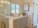 Bathroom featuring a frameless glass shower and custom cabinets, providing a clean, modern space at 1930 Farmington Ct, Clermont, FL 34711