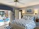 Inviting bedroom with a view to the pool area, creating a serene and relaxing retreat at 1930 Farmington Ct, Clermont, FL 34711