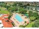 Aerial view of the community pool and sundeck with many lounge chairs for residents at 1930 Farmington Ct, Clermont, FL 34711