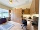 Bright home office with built-in cabinetry, desk space, and a large window offering plenty of natural light at 1930 Farmington Ct, Clermont, FL 34711