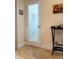 Laundry room door with decorative glass and a small bar cart with wine glasses in adjacent space at 1930 Farmington Ct, Clermont, FL 34711