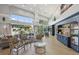 Elegant lobby featuring plush seating, stylish decor, hardwood flooring, and large windows at 1930 Farmington Ct, Clermont, FL 34711