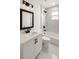 Bathroom featuring a white vanity, tub-shower combination, and black hardware at 2 Pine Terrace Way, Ocala, FL 34472