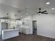 Open-concept living room with ceiling fan, recessed lighting, and kitchen with modern design at 2 Pine Terrace Way, Ocala, FL 34472