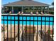 Community pool with lounge chairs and shaded pavilion, creating a relaxing and enjoyable atmosphere at 2106 Elio Ridge Dr, Zellwood, FL 32798
