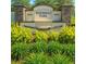 Beautiful Westridge Park entrance sign surrounded by lush green landscaping and colorful plants at 2106 Elio Ridge Dr, Zellwood, FL 32798