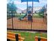 Community playground with a slide, climbing structure, and seating area, perfect for Gathering fun at 2106 Elio Ridge Dr, Zellwood, FL 32798