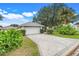 Paver driveway leads to the two-car garage of this well-kept home at 21226 Royal St Georges Ln, Leesburg, FL 34748