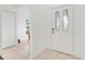 Entrance foyer with tile floors, closet, and a view into the dining room at 21226 Royal St Georges Ln, Leesburg, FL 34748