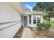 Welcoming entrance with a decorative storm door and a well-maintained walkway at 21226 Royal St Georges Ln, Leesburg, FL 34748