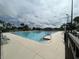 Large community pool with marked lanes, surrounding lounge chairs, and lush landscaping at 21226 Royal St Georges Ln, Leesburg, FL 34748