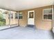 Covered back porch featuring a concrete floor and access to the home and backyard at 2216 River Ridge Rd, Deland, FL 32720