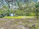 Over an acre, the backyard includes mature trees, a shed, and plenty of space at 2216 River Ridge Rd, Deland, FL 32720