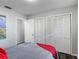 Bedroom with closet door and doorway and a bed with blankets and pillows at 2216 River Ridge Rd, Deland, FL 32720