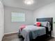 Bedroom with a window, and closet, featuring an elegant bed set at 2216 River Ridge Rd, Deland, FL 32720