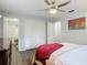 View of the bedroom with closet and bathroom doors, neutral walls and blanket at 2216 River Ridge Rd, Deland, FL 32720