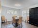Dining room with table set, wood laminate flooring, and natural lighting at 2216 River Ridge Rd, Deland, FL 32720