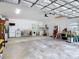 Spacious garage featuring plenty of storage space, laundry area and work area at 2216 River Ridge Rd, Deland, FL 32720