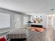 Stylish living room featuring modern decor, wood floors, and ample natural light from the windows at 2216 River Ridge Rd, Deland, FL 32720