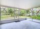 Enjoy this screened porch overlooking the spacious backyard with mature trees and a concrete floor at 2216 River Ridge Rd, Deland, FL 32720