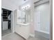 This bathroom offers a large vanity and walk in closet at 224 Silver Maple Rd, Groveland, FL 34736