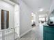 Spacious hallway featuring stylish wood-look tile flooring and a modern design at 224 Silver Maple Rd, Groveland, FL 34736