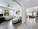 Cozy living room with comfortable seating and wood-look tile flooring at 224 Silver Maple Rd, Groveland, FL 34736