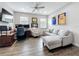 Stylish living room featuring wood-look tile flooring, comfortable seating, and natural light at 224 Silver Maple Rd, Groveland, FL 34736