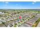 Community aerial view showcasing the neighborhood layout, landscaping, and nearby golf course at 2457 Upton St, The Villages, FL 32163
