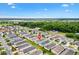 Overhead image of a peaceful neighborhood near a golf course, featuring well-kept lawns at 2457 Upton St, The Villages, FL 32163