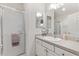 Bathroom featuring a glass-enclosed shower, updated vanity, and great lighting at 2457 Upton St, The Villages, FL 32163