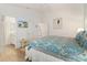 Bedroom with a large bed, TV, and access to an ensuite bathroom for added convenience at 2457 Upton St, The Villages, FL 32163