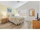 Well-lit bedroom with neutral tones, a comfortable bed, and great natural light at 2457 Upton St, The Villages, FL 32163
