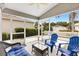 Relaxing screened-in lanai with nice seating, offering peaceful outdoor living at 2457 Upton St, The Villages, FL 32163