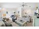 Bright and spacious living room featuring an open layout and hardwood floors at 2457 Upton St, The Villages, FL 32163
