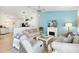 Inviting living area with a fireplace, hardwood floors, a ceiling fan, and ample natural light at 2457 Upton St, The Villages, FL 32163