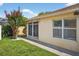 Backyard image shows patio, walkway, and small flowering tree at 2744 Gresham Ave, The Villages, FL 32162