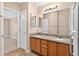 Bathroom with double sink vanity and large mirror at 2744 Gresham Ave, The Villages, FL 32162