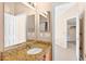 Bathroom featuring granite counters, a large mirror and tile flooring at 2744 Gresham Ave, The Villages, FL 32162