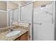 Bathroom with modern shower and grab bar at 2744 Gresham Ave, The Villages, FL 32162