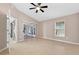 Light bedroom showing sliding glass doors and window at 2744 Gresham Ave, The Villages, FL 32162