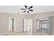 Light bedroom showing entryways and sliding glass doors at 2744 Gresham Ave, The Villages, FL 32162