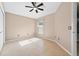 Well-lit bedroom with fan and tile flooring at 2744 Gresham Ave, The Villages, FL 32162