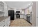 Updated kitchen featuring white cabinets, stainless steel appliances, and granite countertops at 2744 Gresham Ave, The Villages, FL 32162