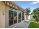 Covered patio with large sliding doors and a view of the backyard at 2744 Gresham Ave, The Villages, FL 32162