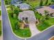 Aerial view of this single Gathering home highlighting the driveway, landscaping, and corner lot location at 3001 Lake Huron Ln, Tavares, FL 32778