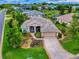 Expansive aerial view of this single Gathering home highlighting the landscaping, trees and the driveway at 3001 Lake Huron Ln, Tavares, FL 32778